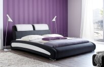 Cancun z kolekcji m.trade to łóżko tapicerowane ekoskórą czarną z białymi wstawkami